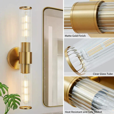 Vertical matte gold wall sconce with clear glass tube and safe socket features