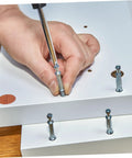 Easy Install No Drill Needed Screw Hole Covers For Furniture And Cabinets, shown being used on white furniture surface