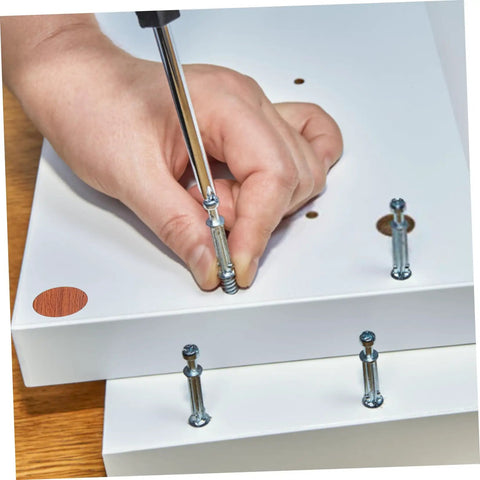 Easy Install No Drill Needed Screw Hole Covers For Furniture And Cabinets, shown being used on white furniture surface