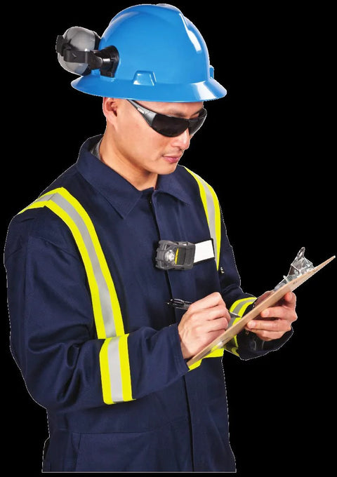 ALTAIR 2X gas detector worn by safety worker; blue hard hat, high-visibility vest, clipboard.
