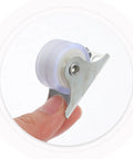 Ultra Silent 1 Inch PVC Swivel Caster Wheel for Furniture held in hand, showcasing mini size and smooth rotation.