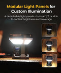 Modular camping lamp with detachable panels on dark background, showcasing brightness control and custom illumination features.