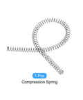 Compression spring, stainless steel, silver tone, front view showing long coiled form and extended tail.