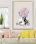 Legit Interactive Wedding Fingerprint Canvas Guest Book Pairing Six Bright Inks With A Cool Couples Bike Design hung in a cozy living room.