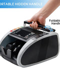 Person holding Money Counter Machine With UV MG IR Counterfeit Detection, Portable Bill Counter with foldable handle.