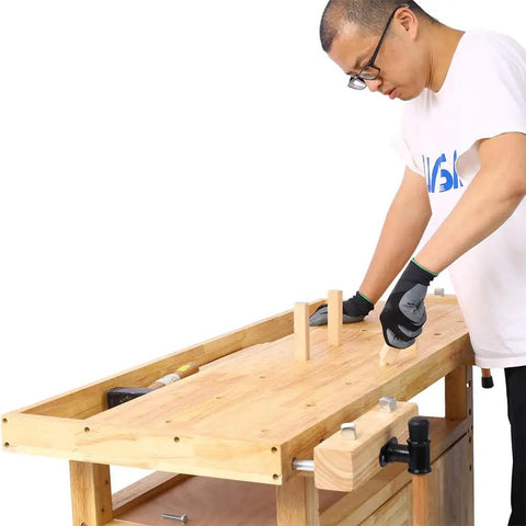 Person working on 55 Inch Heavy Duty Rubber Wood Workbench With 3 Drawers Storage Cabinet Tool Well And Adjustable Vise Pro Grade