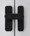 Sturdy Black Zinc Alloy Barn Door Latch With 180 Degree Slide Lock For Wood Doors on white wooden panels.