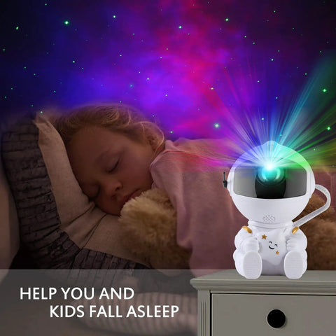Child sleeping under Mini Galaxy Projector Night Light With Remote Control for Kids Bedroom Ceiling Decor Nebula Aurora Starry Sky Projector, Lit For Cars, Offices, And Game Rooms, Cute Astronaut Version 2 casting nebula.