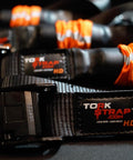 Self Tensioning Tie Down Straps 14 Ft X 1.5 In, 2 Pack With Load Adaptive Tech, No Ratchet Tension, close-up of material and label