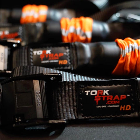 Self Tensioning Tie Down Straps 14 Ft X 1.5 In, 2 Pack With Load Adaptive Tech, No Ratchet Tension, close-up of material and label