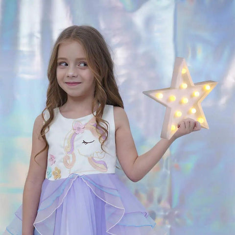 Girl holding Star Shaped LED Marquee Light With 11 Warm White LEDs, Battery Operated By 2 AA, Wall Or Mantel Decor