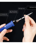 Hands holding 992D Plus All In One Pro Grade Soldering Station iron with high-temp resistant grip and soldering tip.