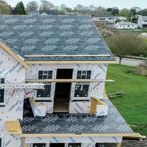 Rock Solid Self Adhering Ice And Water Shield Roof Underlayment 36 Inch By 66.6 Feet 200 Square Foot Roll on a roof during installation.