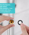 Hand holding part of 20 Piece Shower Head Filter Gasket Set Rubber Washers And Stainless Steel O Ring Hose Gaskets For Water Faucet Shower Head And Garden Hose Connectors Kit