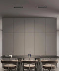 No Hassle 15W Linear Recessed Downlight With Sleek Black Trim illuminating a modern dining room with minimal design.