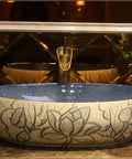 Bathroom Sinks Bathroom Vessel Sink Carved Lotus Art Countertop Basin oval ceramic washbasin with intricate lotus design.