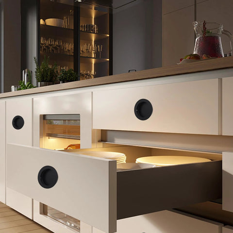 Recessed Pocket Door Pull Handles 2 And 3 Quarter Inch Round Finger Flush Pulls for Barn Doors in use on kitchen drawers