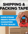 Person using Heavy Duty Packing Tape 2 Inch Wide By 800 Inch Long Clear Two Roll Pack With Dispenser on a cardboard box