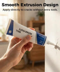 Hand applying Wall Repair Paste Kit For Cracks And Holes With Quick Drying Formula to wall with smooth extrusion design