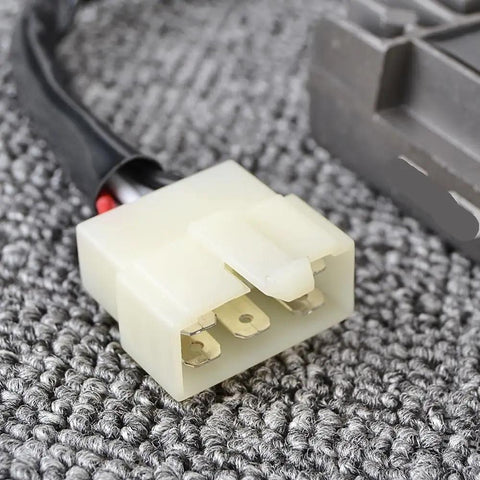 Voltage Rectifier For Motorcycle Electrical System With High Efficiency Regulator Controller For SR125 1997 1998 1999 2000 Keeps Your Battery Charged Low Heat Synchronous Rectification For Stronger Charging connector detail on grey background