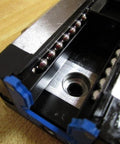 Close-up of R165129310 Ball Carriage Rexroth Kugelwagen showing internal ball bearings for linear guide rails precision motion