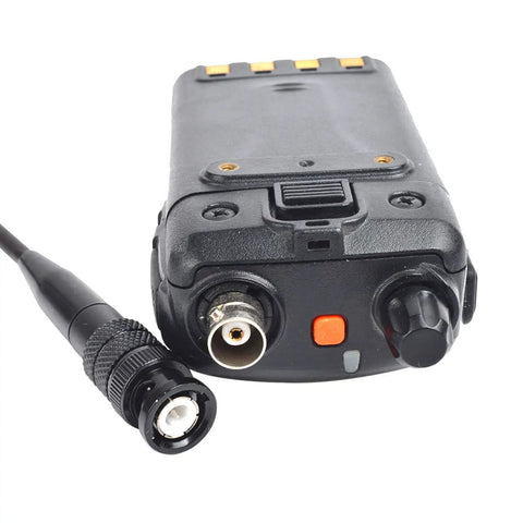 Close-up of handheld radio with BNC port for Dual Band Telescopic Soft Antenna For VHF UHF 2M 70CM With BNC Connector Adjustable 8 To 14 Inch Length Boosts Range On Vertex Handheld Radios Like HR146 HX300 HX320 HX400 Excellent For Clear Strong Comms