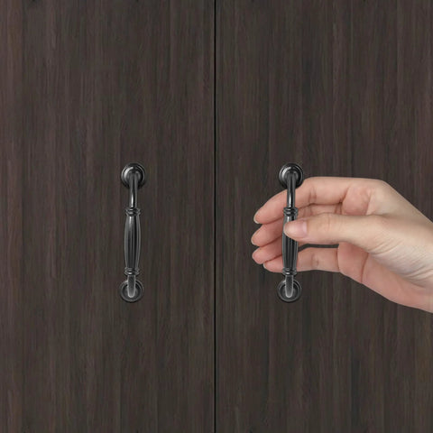 Black Cabinet Handles Set, 3 3/4 Inch Hole Center (96mm), being installed on dark wooden cabinet door.