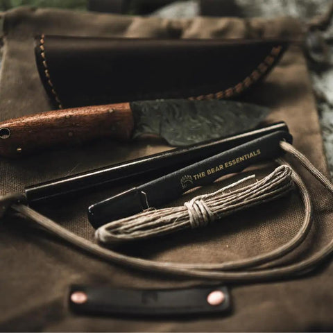 Prepper-Ready Large 6 Inch Ferro Rod With Tungsten Carbide Striker And Sharpener on burlap sack with paracord and knife