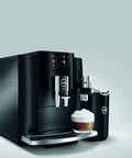 Top Shelf Fourth Generation Automatic Coffee Machine In Piano Black with creamy latte served, 17.6x11x13.8 inches for easy use.