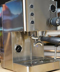Top Tier Dual Boiler Espresso Maker With Smart Thermoblock And Precise PID Temp Control featuring a 58mm portafilter in glossy stainless steel.