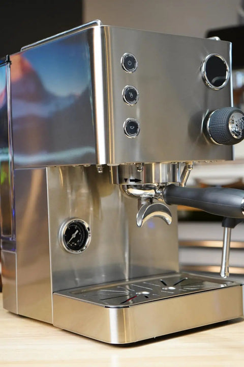 Top Tier Dual Boiler Espresso Maker With Smart Thermoblock And Precise PID Temp Control featuring a 58mm portafilter in glossy stainless steel.