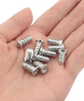 Top Tier Flat Head Replacement Screws For Panel Fixing And Furniture Assembly Hella Durable One Half Inch Nickel Plated Iron Fasteners in hand.