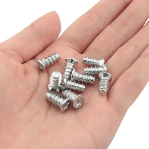 Top Tier Flat Head Replacement Screws For Panel Fixing And Furniture Assembly Hella Durable One Half Inch Nickel Plated Iron Fasteners in hand.