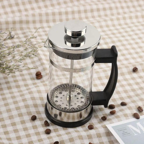 French Press Coffee Maker With Ergonomic Handle, Food Grade Stainless Steel Turkish Coffee Pot And Espresso Brewer on table