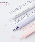Gel Pens Set Cute Stationery Trio With 0.5mm Fine Point Quick Dry Ink For Journaling And Aesthetic Office Vibes, showing two black pens and one coral.