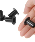 Four Pack Nylon Flanged Sleeve Bearings With 10.1 Mm Bore And 12 Mm Outer Diameter held in hand, showing black nylon material.