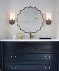 Cool Industrial Black Wall Sconces Two Pack With Cylindrical Clear Glass Shades in modern bathroom setting