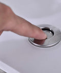 Sink Top Air Switch Kit For Garbage Disposal With Long Button Brushed Nickel Finish Stainless Steel Button Cover Fits Any Food Waste Disposer And Dishwasher Easy Install And Durable in use, finger pressing brushed nickel button on sink.