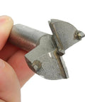 Workhorse Self Centering Wood Drill Bit And Hole Saw Kit With Tct Carbide Blades That Slice Clean Through Plywood And Plastic Boards Without Tear Out Or Chatter At Forty Millimeters close-up of carbide cutter in hand.