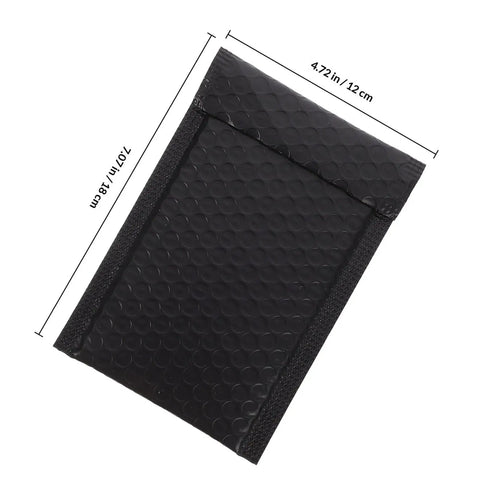 Close-up of Black Bubble Mailers 12 By 18 Inch Plus 4 Inch Padded Self Seal Shipping Bags showing texture and dimensions.