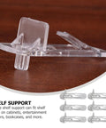 Close-up of clear plastic shelf support peg from 30 Pack Plastic Shelf Support Pegs for Cabinets and Wood Shelves Burr Free Smooth Surface Pegs Easy Hand Installation No Tool Needed Heavy Duty Clear Pegs for Home Office and Store Shelves No Drill DIY Friendly.