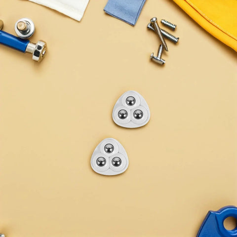 Hella Smooth Mini Stainless Steel Swivel Casters With Strong Adhesive Backing For Silent Furniture Cart Movement Wear Resistant Three Ball Bearing No Fuss Setup Pack Of Forty Eight Pieces on a beige surface.