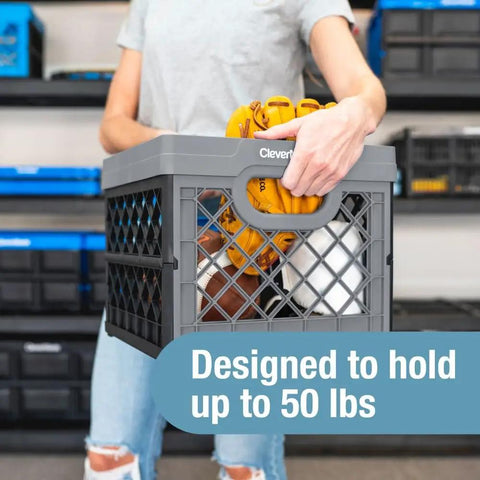Person lifting Heavy Duty Collapsible Milk Crate 25L Six Point Six Gal with gloves inside, designed to hold 50 lbs, obsidian black.