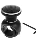 SHMZK steering wheel knob spinner, angled front view, black with faceted top, metal bearing, 360° rotation; includes Allen wrench