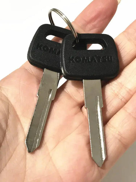 Heavy Equipment Keys 2 Pack For Forklifts And Equipment Compatible With Kalmar Dressta Sakai Forklifts Budget Friendly OEM Quality At A Fraction Of The Price., two Komatsu forklift keys on a ring held in hand