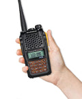 Hand holding UV-6R Ham Radio Handheld 5W Walkie Talkie For Adults with FM Transceiver, showing dual-band display and keypad.
