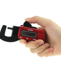 Person holding a digital caliper with LCD for measuring metal and plastic, part of a Two Pack Digital Thickness Gauge Caliper Micrometer For Precise Measurement Of Metal And Plastic Thickness Portable Easy Readout On The Go Industrial Automotive Grade Tool Set