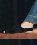 Overnight Bunion Corrector For Men And Women, Big Toe Straightener Night Splint on foot resting on wooden surface