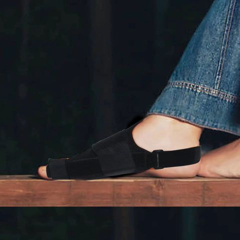 Overnight Bunion Corrector For Men And Women, Big Toe Straightener Night Splint on foot resting on wooden surface