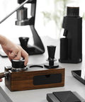 Person using Dual Spring 58mm Espresso Tamper With Auto Rebound And Auto Leveling, 58.35mm Coffee Press Tool for 58mm Machines